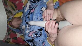 Before bed time, the wife masturbates using a magic wand