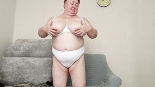 Stepmom with big tits caresses herself in front of the camera