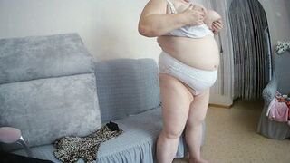 Mother-in-law with big tits caresses herself in front of the camera