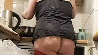 Wife in kitchen teasing husband to have sex while he watches