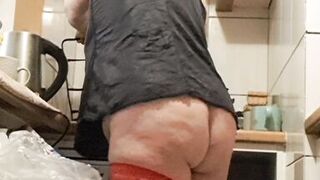 Wife in kitchen teasing husband to have sex while he watches