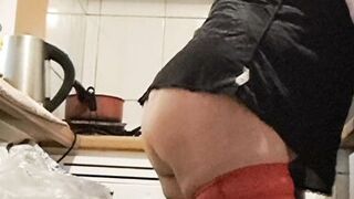 Wife in kitchen teasing husband to have sex while he watches