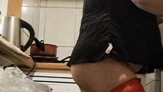 Wife in kitchen teasing husband to have sex while he watches