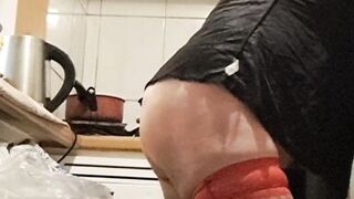 Wife in kitchen teasing husband to have sex while he watches