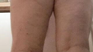 in the kitchen half-dressed