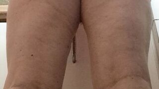 in the kitchen half-dressed