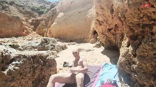 Blowjob with cumshot on a crowded beach... - 1 image