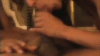 Two ebony honeys share one hard cock in front of the fireplace - 15 image