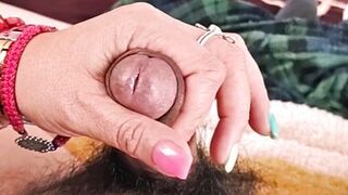 She masturbates me and my penis gets wet with droplets of pleasure.