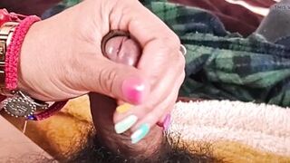 She masturbates me and my penis gets wet with droplets of pleasure.