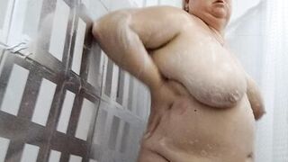 Naked stepmom with big tits and ass takes a shower