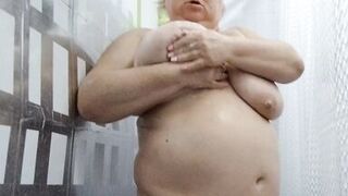 Naked stepmom with big tits and ass takes a shower