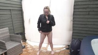 Sexy wife posing in the Yard naked in Leather coat