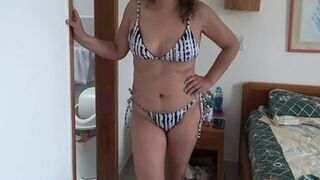 I love showing off in erotic lingerie and a bikini on the beach