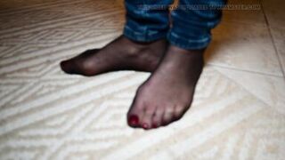 Feet in black stockings and jeans - 10 image