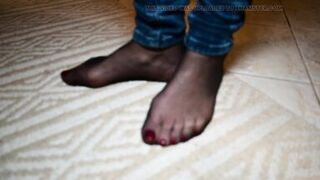 Feet in black stockings and jeans - 15 image