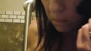 Horny milf plays in bar bathroom